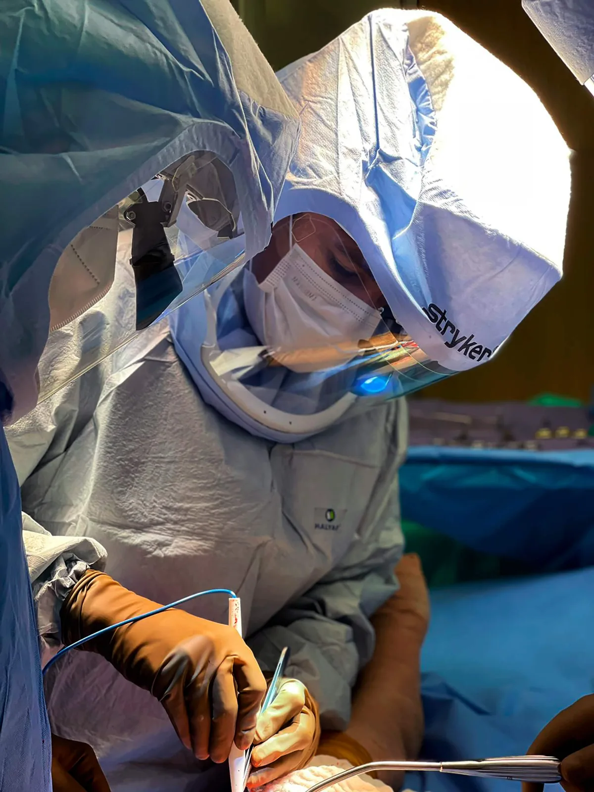 Dr. Galvis operating with robotic assistance